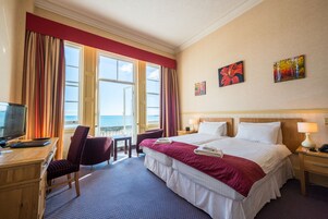 Twin Room, Sea View | Desk, iron/ironing board, bed sheets
