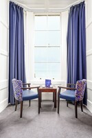 Superior Quadruple Room, Sea View | Desk, iron/ironing board, bed sheets