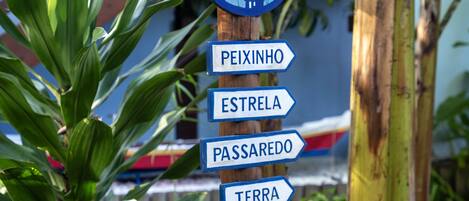 A signpost with directional arrows pointing to various destinations.