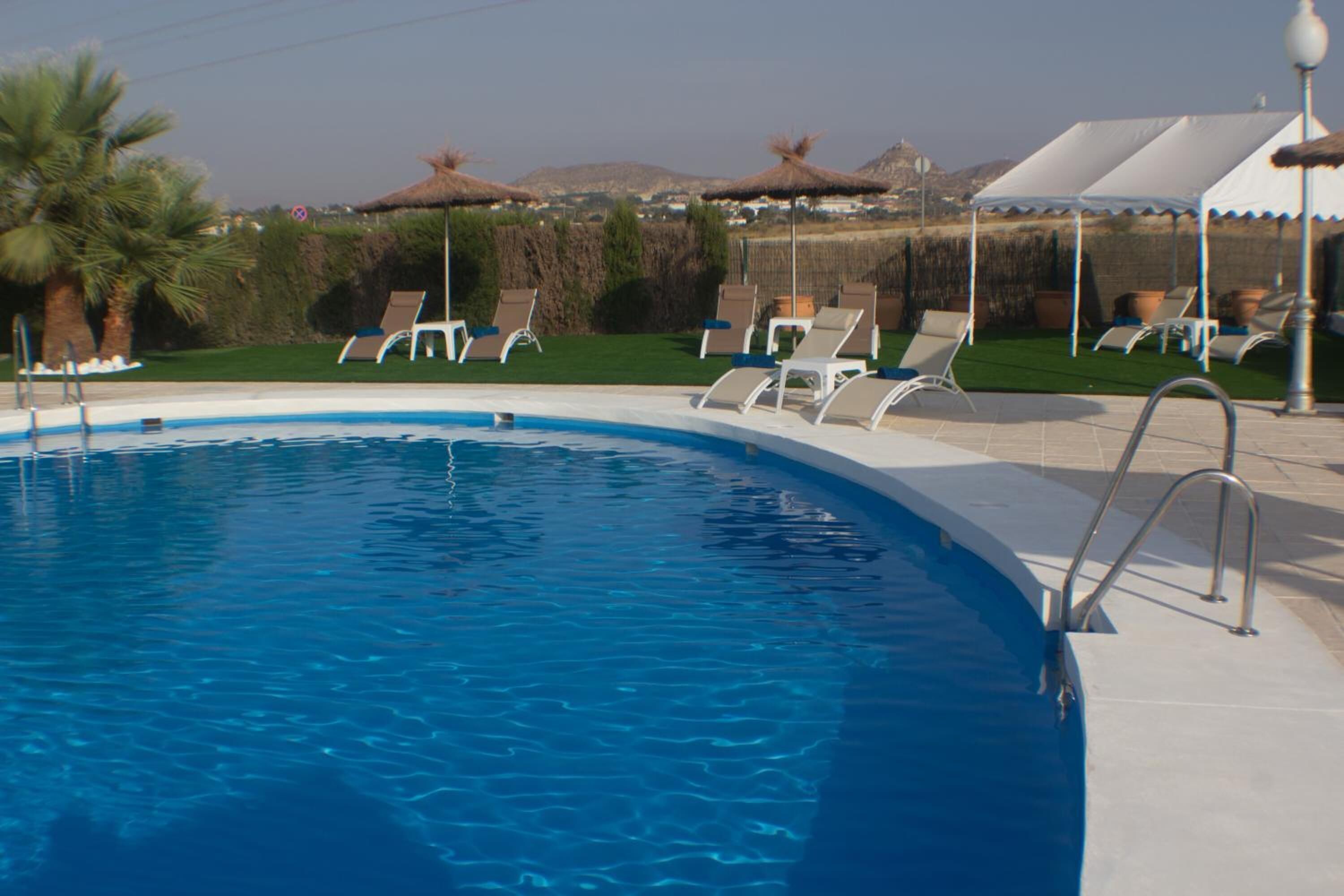 seasonal outdoor pool, pool umbrellas, pool loungers