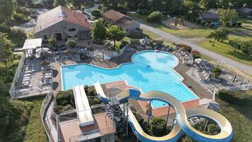 Seasonal outdoor pool, open 9:00 AM to 8:00 PM, pool umbrellas