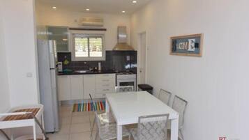 Villa, Pool View | Private kitchenette | Fridge, microwave, oven, stovetop