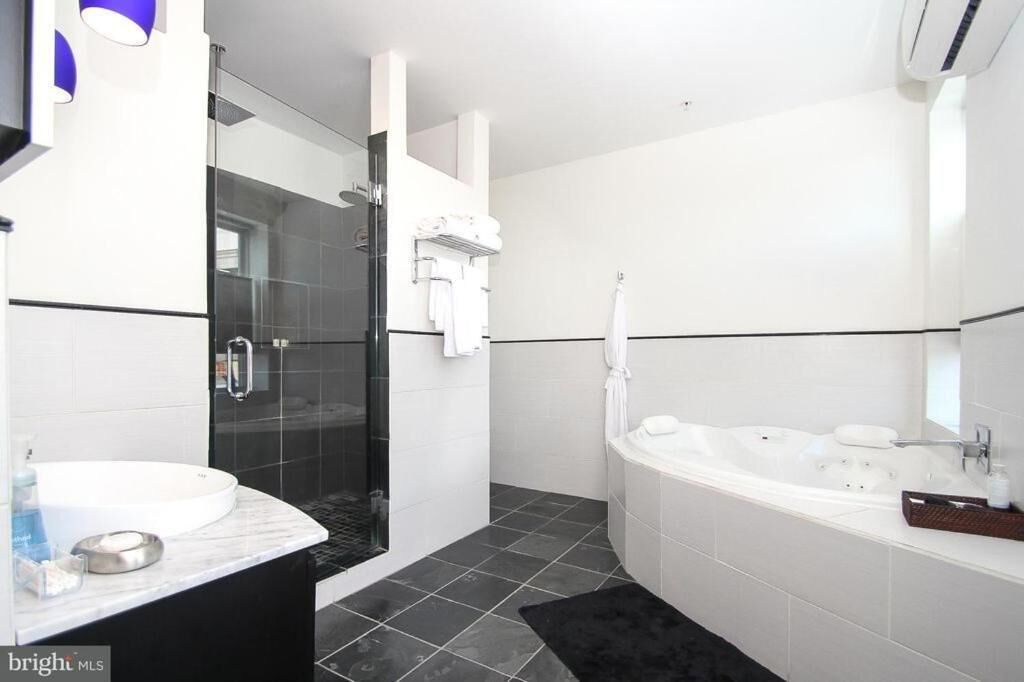 Shower, hydromassage showerhead, designer toiletries, hair dryer