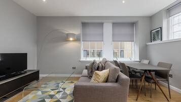 Classic Apartment, 2 Bedrooms | Living area | Flat-screen TV