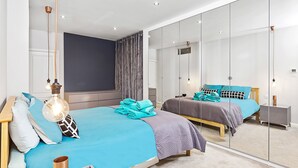 Suite Elite, 2 habitaciones, 2 baños, planta ejecutiva | 2 dormitorios, tabla de planchar con plancha, wifi gratis y ropa de cama
