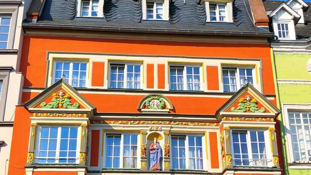 A multi-story building with a prominent sign reading "HOTEL WELL". - Hotel Well Garni (Wittlich)