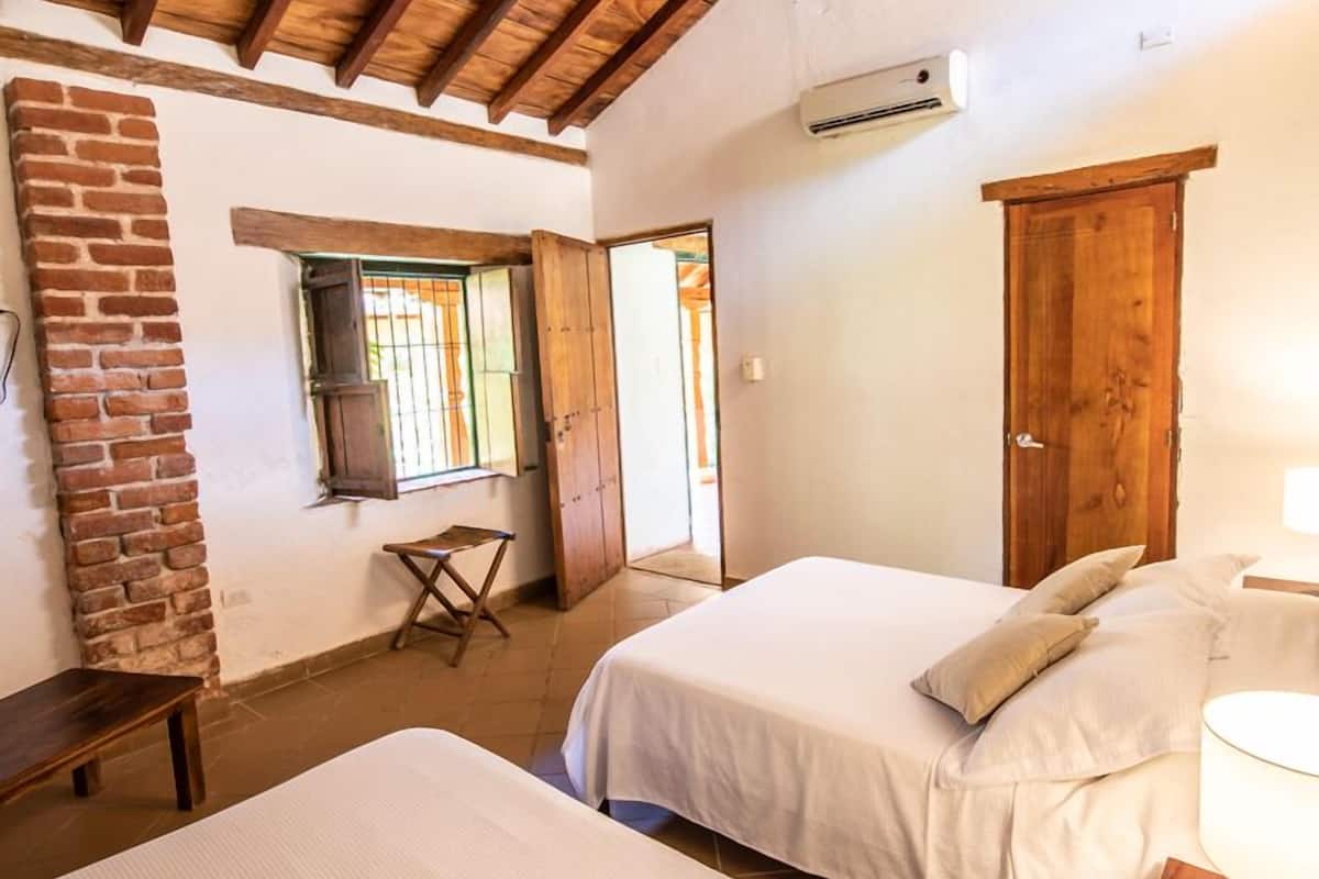 classic suite, 1 queen bed, courtyard view | in-room safe, free cots/infant beds, rollaway beds, free wifi