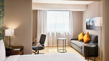 Suite, 1 King Bed with Sofa bed | Living area | 55-inch flat-screen TV with cable channels, TV