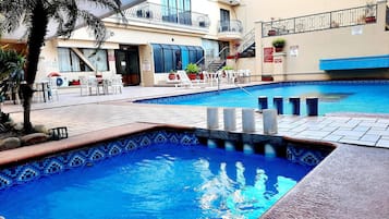 Outdoor pool, open 7:00 AM to 10:30 PM, pool loungers