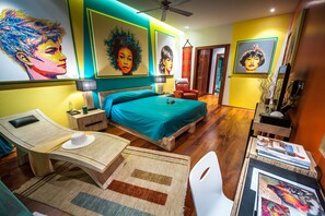 A modern bedroom with a bed, bedside tables, a desk, and a chair. - Almali Luxury Residence (Rawai)