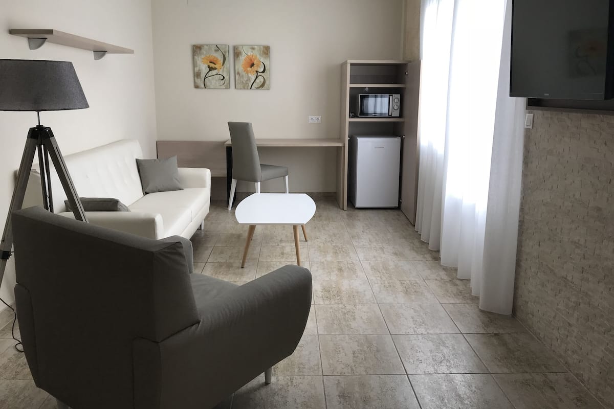 Superior Double Room | Living room | Flat-screen TV