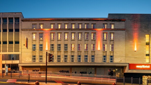 A modern hotel building with multiple floors, large windows, and a prominent "easyHotel" sign. - easyHotel Sheffield (Sheffield)