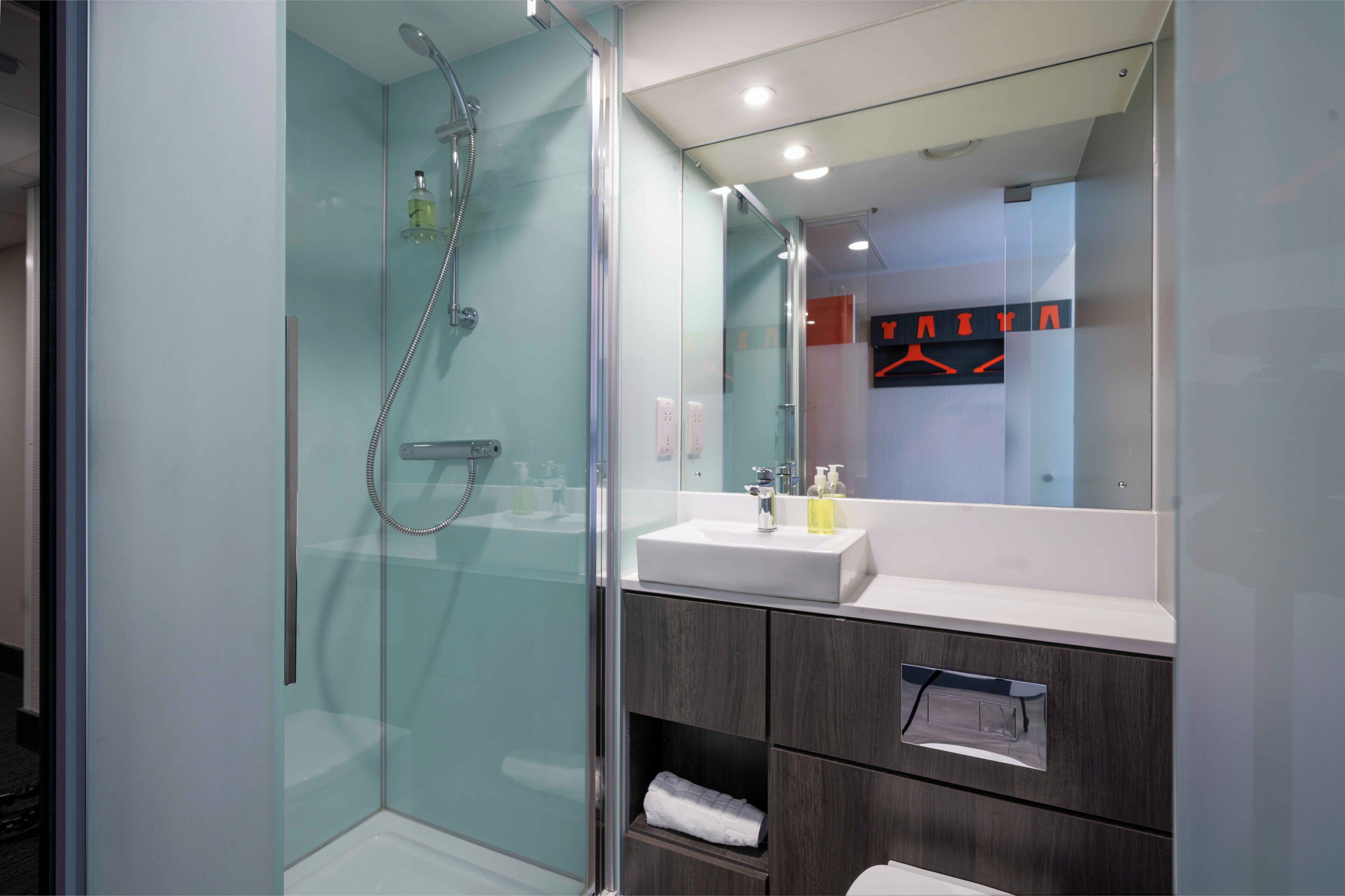 Shower, eco-friendly toiletries, towels, soap
