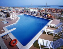 Seasonal outdoor pool, open 9 AM to 6 PM, sun loungers