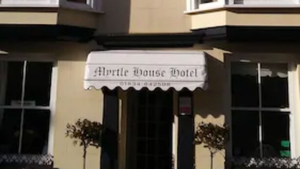 A two-story building with a sign reading "Myrtle House Hotel." - Myrtle House Hotel (Tenby)