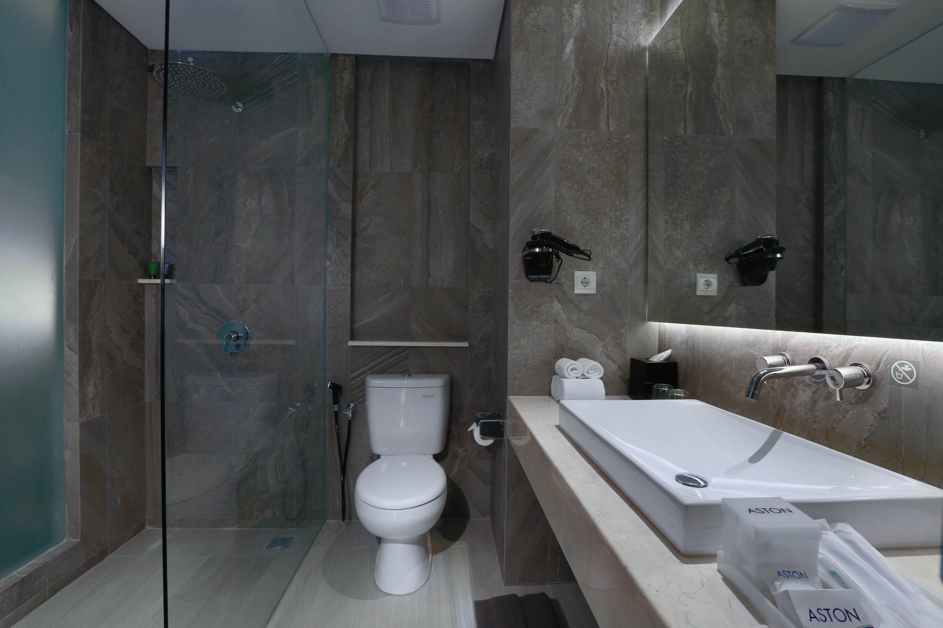 junior suite | bathroom | shower, free toiletries, hair dryer, slippers