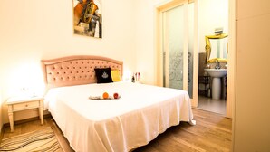 A neatly made bed with a white bedspread, a headboard, and a pillow. - Red Hotel Downtown Unirii (Cluj-Napoca)