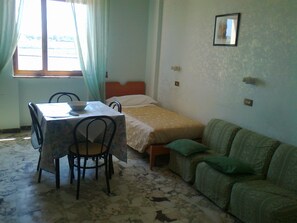 Economy Apartment, 2 Bedrooms | Living area | Flat-screen TV - Hotel L'Approdo (Brindisi)