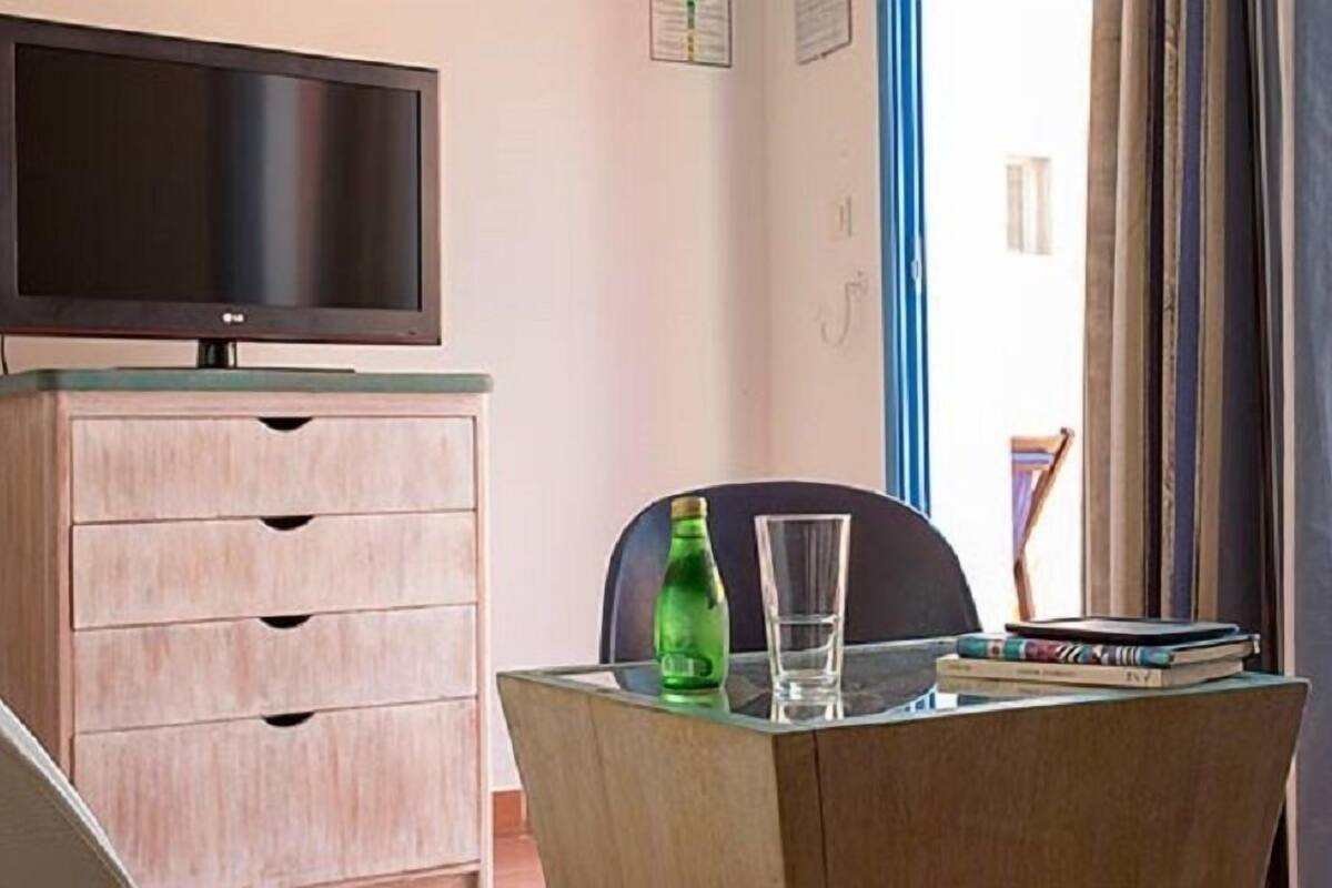 Standard Double Room | Minibar, in-room safe, desk, blackout drapes