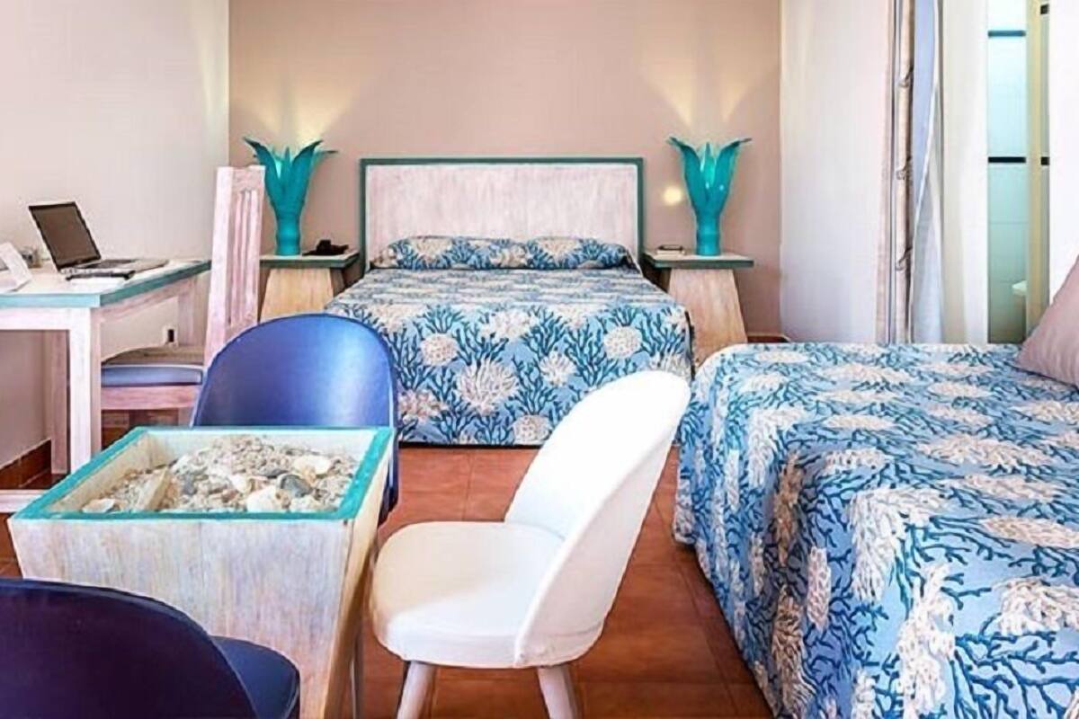 Deluxe Suite, Terrace, Sea Facing | Minibar, in-room safe, desk, blackout drapes