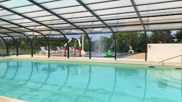 Indoor pool, seasonal outdoor pool, pool umbrellas, pool loungers