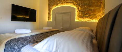 Luxury Room | Living area | Flat-screen TV