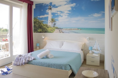 Double Room, Balcony, Partial Lake View | Minibar, in-room safe, individually decorated, desk