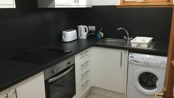Apartment | Private kitchen | Full-size fridge, microwave, oven, stovetop