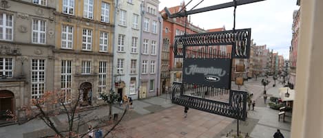 A historic building with multiple stories, large windows, and ornate architectural details.