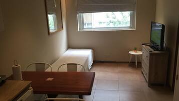 Apartment, 1 Bedroom | Living area | Flat-screen TV