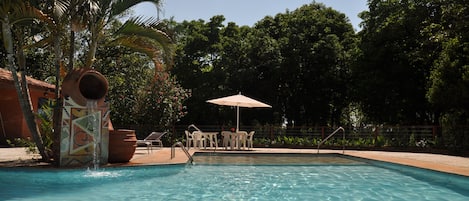 Outdoor pool, pool umbrellas, sun loungers