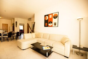 Penthouse, 2 Bedrooms | Living area | Flat-screen TV
