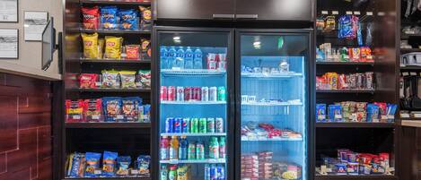 A vending machine stocked with snacks and beverages.