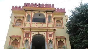 A traditional building with ornate architectural details, including multiple arches and decorative elements. - Hotel Green Haveli (Pushkar)