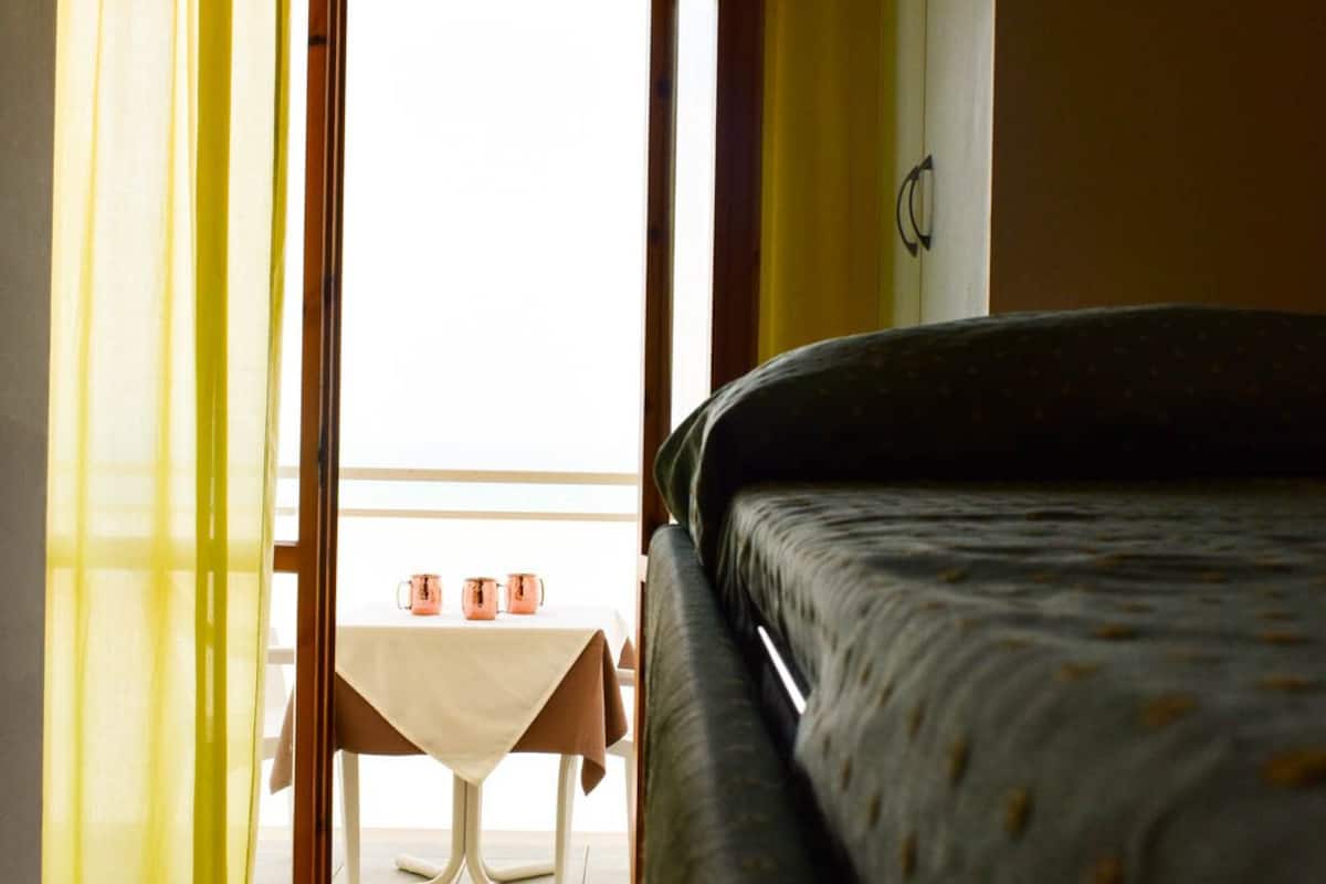 basic quadruple room | in-room safe, desk, bed sheets