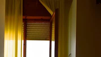 Basic Quadruple Room | In-room safe, desk, bed sheets