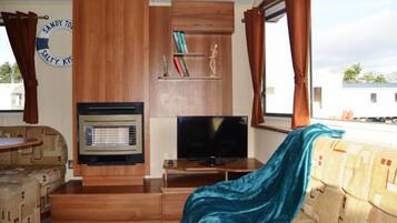 Luxury Mobile Home, Multiple Beds, Garden View | Living area | Flat-screen TV, fireplace, pay films