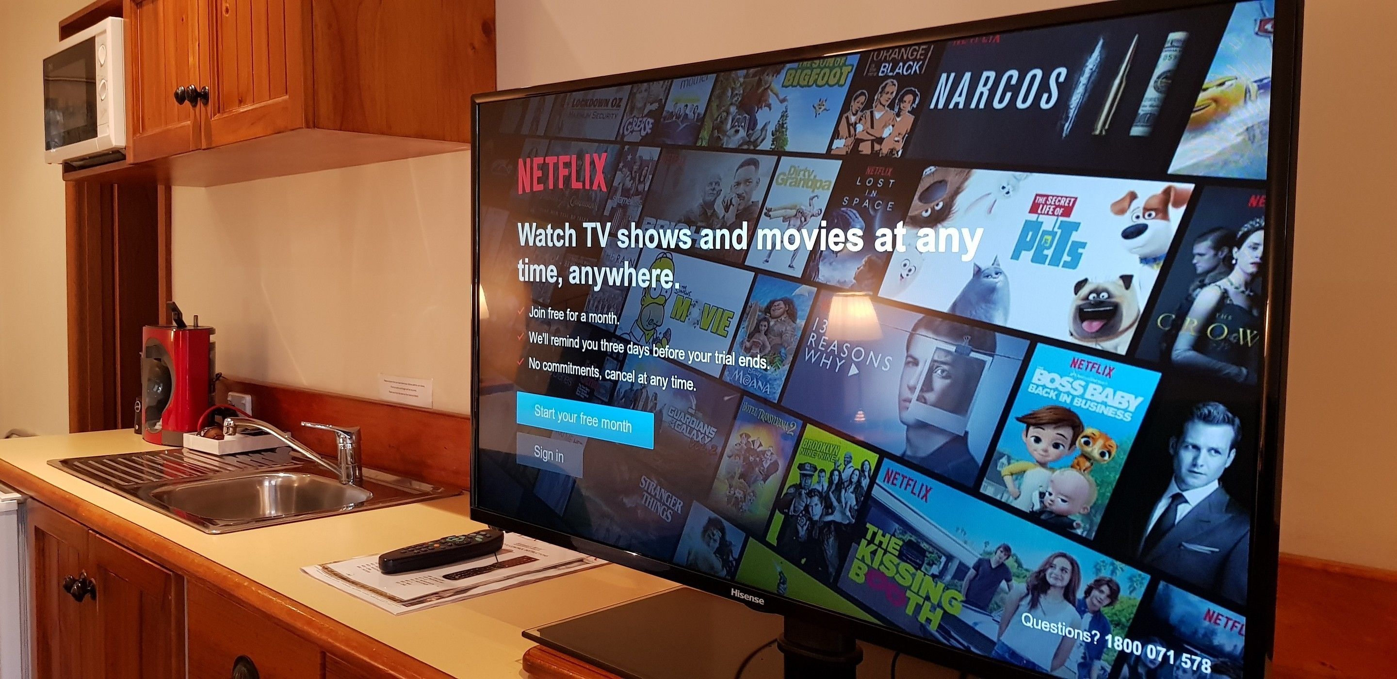 A television displaying a Netflix interface with various shows and movies.