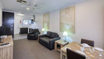 Deluxe Apartment, 1 Bedroom | Living area | 47-inch Smart TV with cable channels, TV