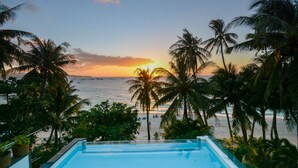 A pool with a view of the beach and palm trees. - Signature Boracay Blue (Boracay Island)