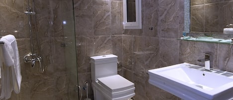 Shower, free toiletries, slippers, towels