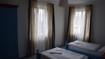 Deluxe Suite, 2 Bedrooms, Courtyard View, Courtyard Area | Blackout curtains, free WiFi, bed sheets