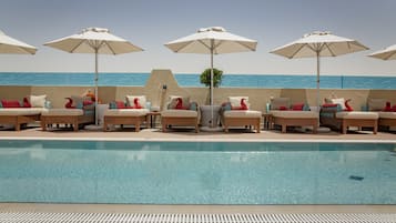 Outdoor pool, open 6:30 AM to 10 PM, pool umbrellas