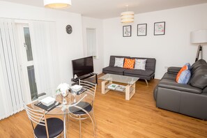 Deluxe Apartment, 2 Bedrooms, Ensuite, River View | Living room | 40-inch flat-screen TV with digital channels, TV