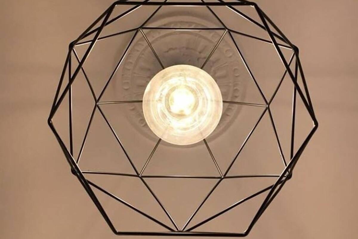 A geometric ceiling light fixture with a central bulb.