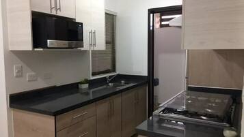 Family Townhome, 2 Bedrooms | Private kitchen | Full-sized fridge, microwave