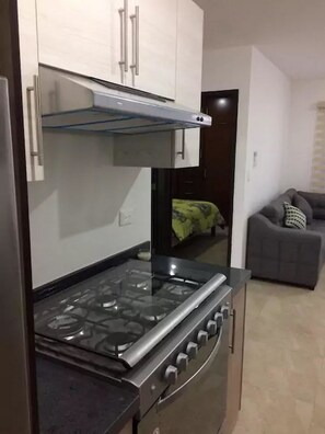 Family Townhome, 2 Bedrooms | Private kitchen | Full-size fridge, microwave, stovetop, cookware/dishes/utensils - Condo SA (Mazatlán)