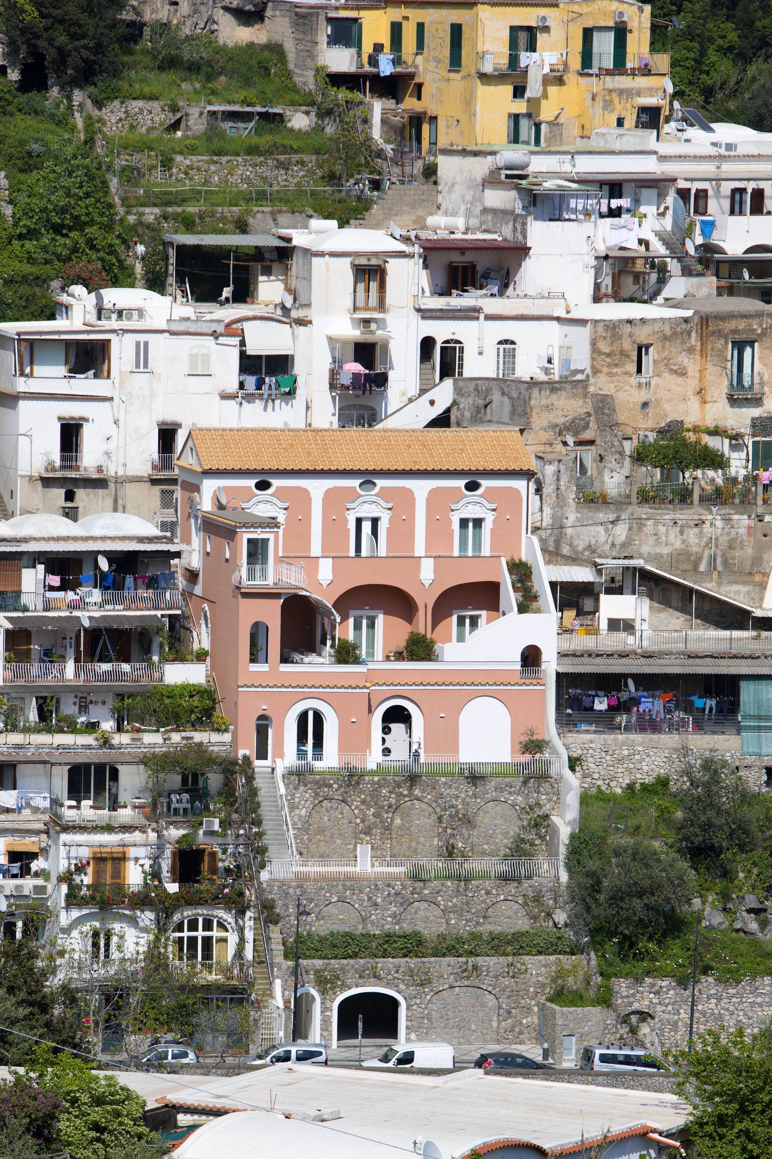 A multi-story building with balconies and a central courtyard.