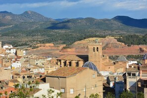 A town with historic architecture, including a prominent tower and traditional buildings.