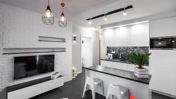 Departamento | Área de sala de estar | Televisión de pantalla plana de 49 pulgadas con canales por cable